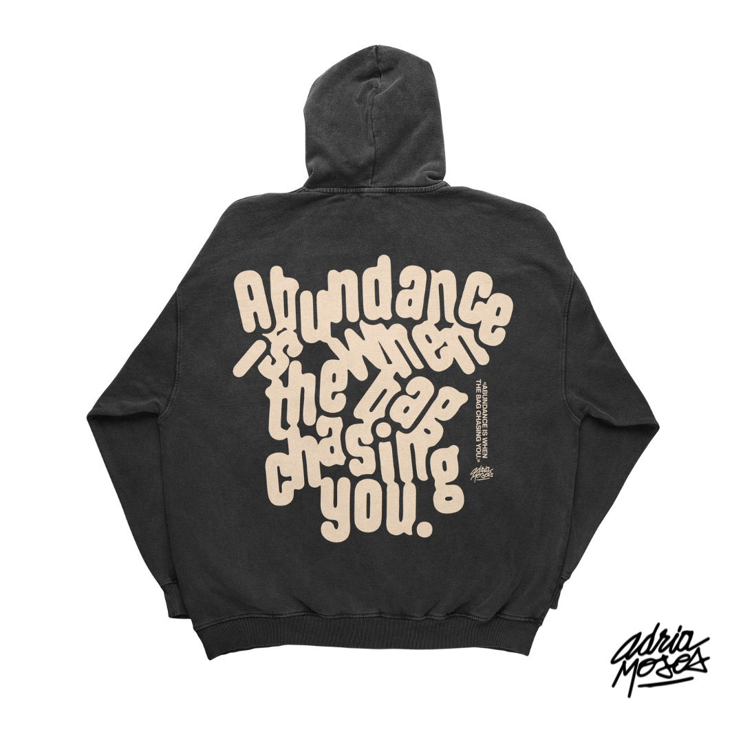 "Abundance is When the Bag Chasing You" Vintage Black Hoodie